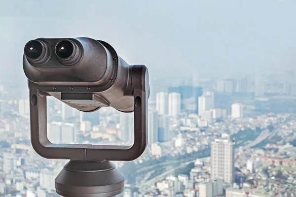 Tourist binocular close-up on the observation desk in a big megapolis city — Stock Photo, Image