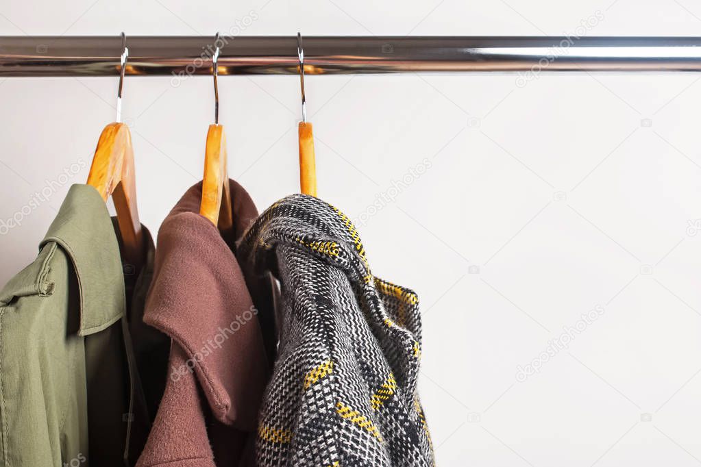 Set of womans outwear for autumn and winter season on hangers