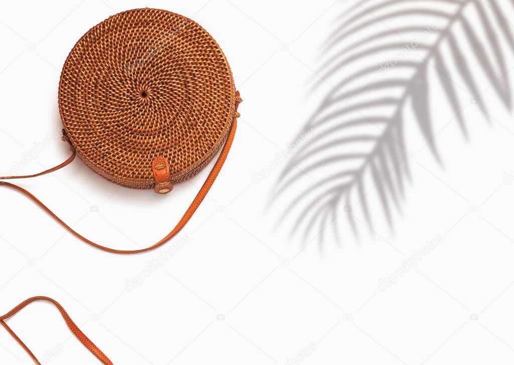 Eco bag of round shape isolated on the white background with palm shadow and copy space