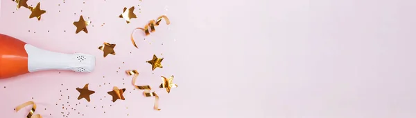 Banner with with bottle of rose champagne and golden star confetti — Stock Photo, Image