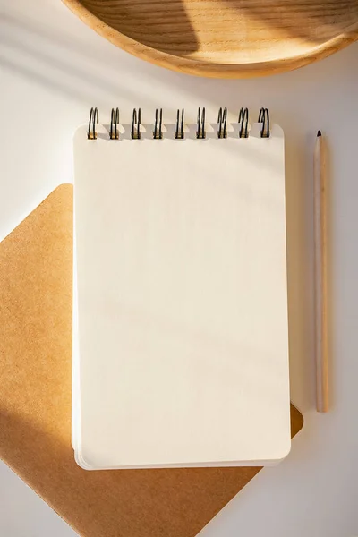 Stationary mock-up on the white table with shadows. — Stock Photo, Image