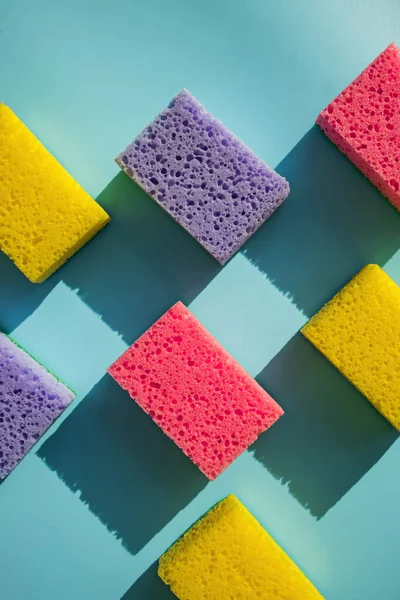 Cleaning sponges for washing dishes on blue background i