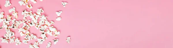 Popcorn Scattered Pink Background Top View Banner Format Place Text — Stock Photo, Image