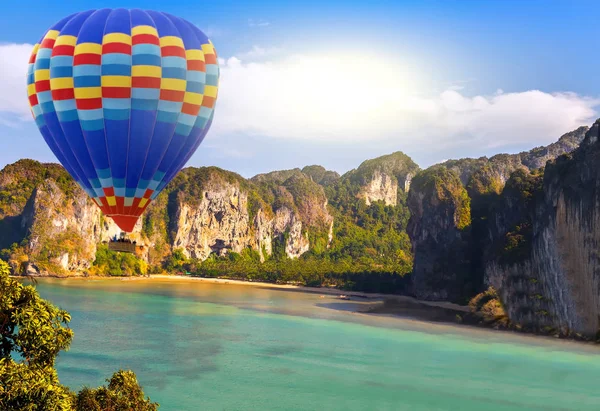 sun hot air balloon landing in a mountain jungle island sea landscape