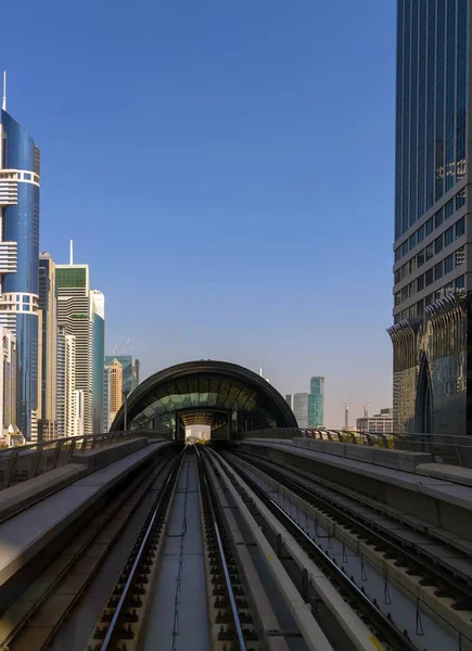 Dubai Metro Network line on the urban landscape UAE, architecture building Station construction automated urban subway systems.