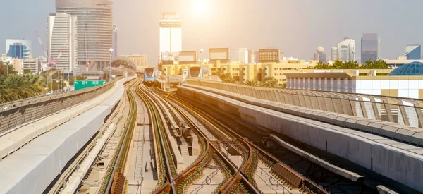 Dubai Metro Network line on the city urban landscape UAE, architecture subway systems.