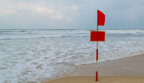 Tropical beach red flag, danger waves water natural landscape. Beach Summer seascape azure water in Blue ocean. Summer paradise beach , Danang, Vietnam