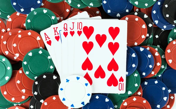 Playing cards royal flush in hearts casino poker chips — Stock Photo, Image