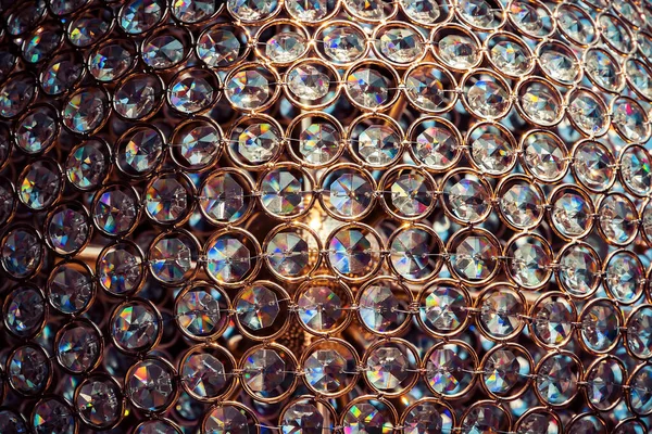 浅金圆晶晶切割钻石聚光灯背景 — 图库照片