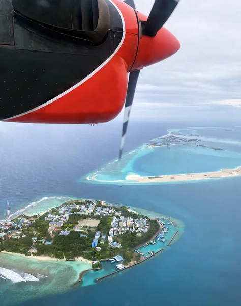 Seaplane cruise, Maldives atoll island plane getaway. Aerial view of Beautiful beach with water bungalows, Hydroplane summer vacation. Indian Ocean