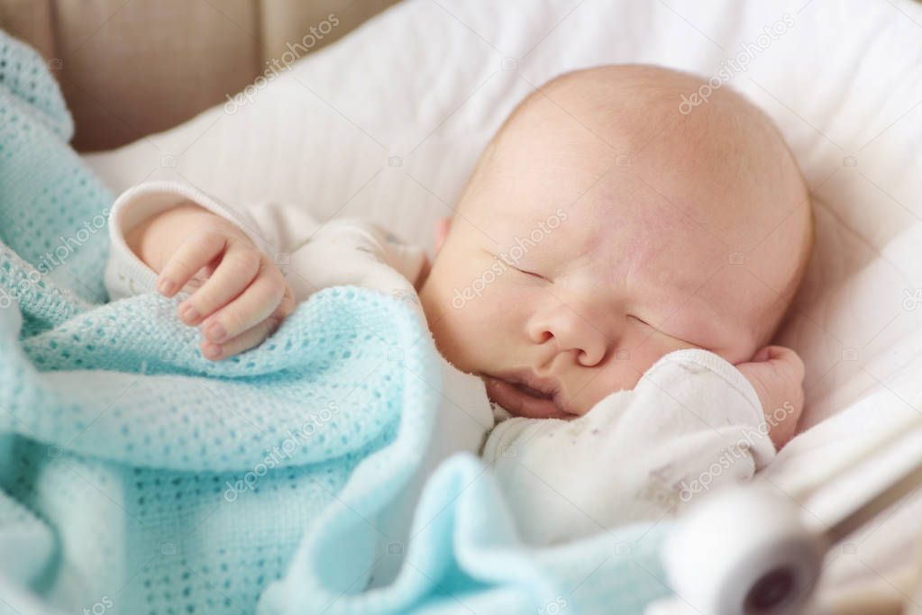 cute  newborn baby sleeping in the crib