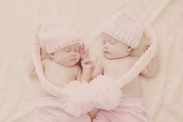 Sleeping Twins Wearing Funny Hats Big Pompoms — Stock Photo, Image