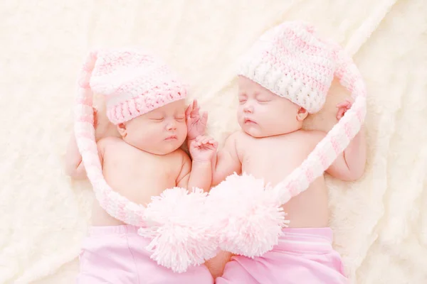 Sleeping Twins Wearing Funny Hats Big Pompoms — Stock Photo, Image