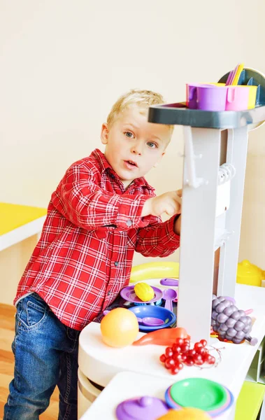 Blonde Toddler Boy Playing Toy Kitchen — Stock Photo, Image