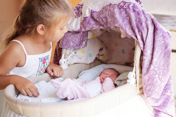 Little Girl Looking Newborn Baby Crib — Stock Photo, Image