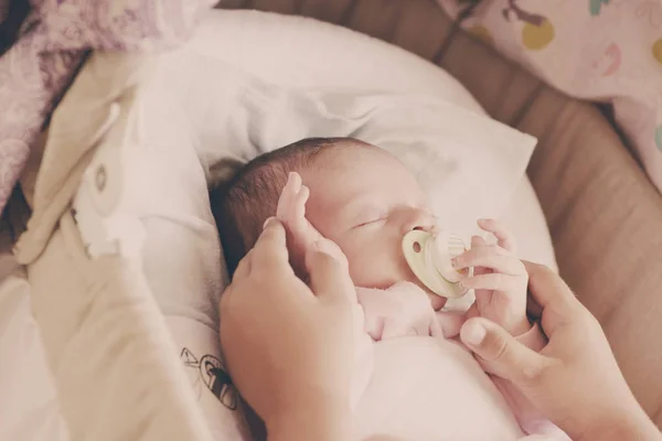 Newborn baby in crib — Stock Photo, Image