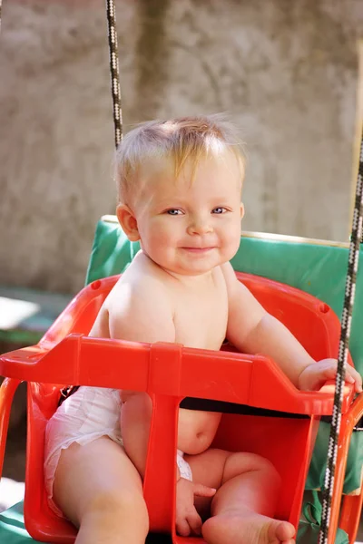 Baby in the  swing — Stock Photo, Image