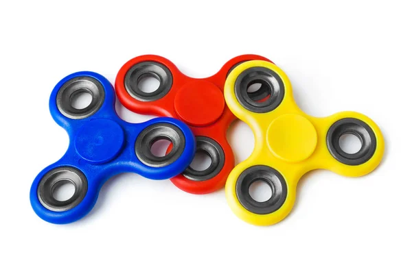 Veelkleurige Spinners Geïsoleerd Witte Achtergrond — Stockfoto