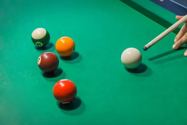 Billiard balls on pool green table - sport background