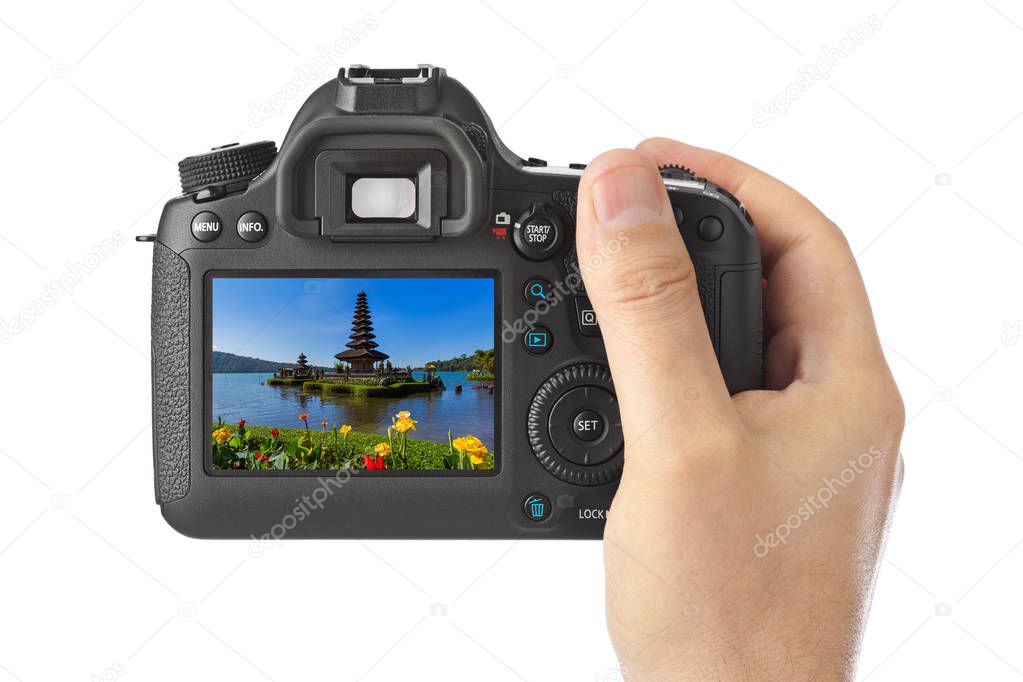 Camera and Ulun Danu Temple ib Bali Indonesia (my photo) isolated on white background