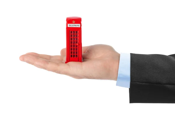 Hand Met Speelgoed Rode Telefooncel Van Londen Geïsoleerd Witte Achtergrond — Stockfoto