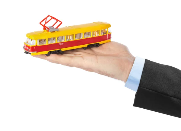 Hand Mit Spielzeug Straßenbahn Isoliert Auf Weißem Hintergrund — Stockfoto