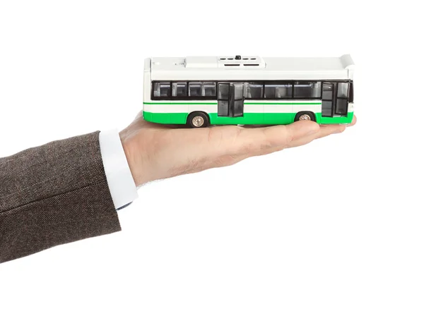 Hand Met Speelgoed Bus Geïsoleerd Witte Achtergrond — Stockfoto