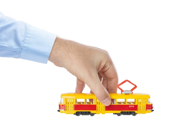 Hand Mit Spielzeug Straßenbahn Isoliert Auf Weißem Hintergrund — Stockfoto