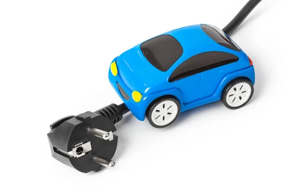 Электрическая розетка и игрушечный автомобиль — стоковое фото