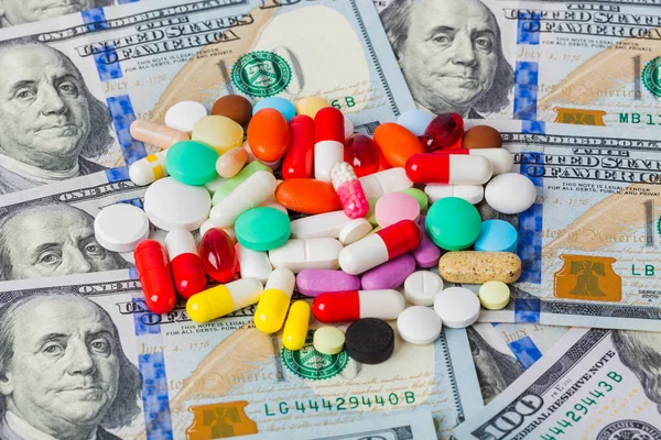 Pills and money - business medical background — Stock Photo, Image