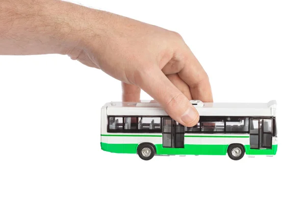 Mano con autobús de juguete — Foto de Stock