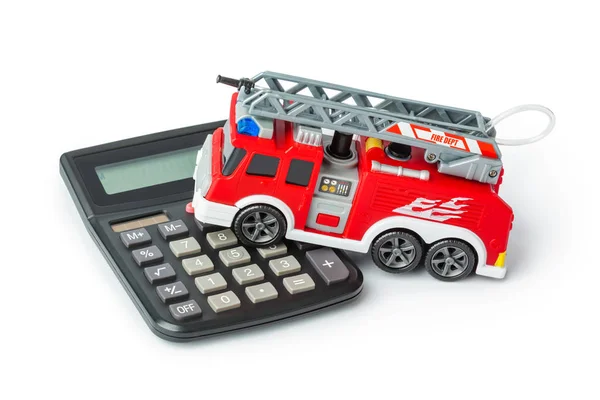 Calculator and toy fire truck — Stock Photo, Image