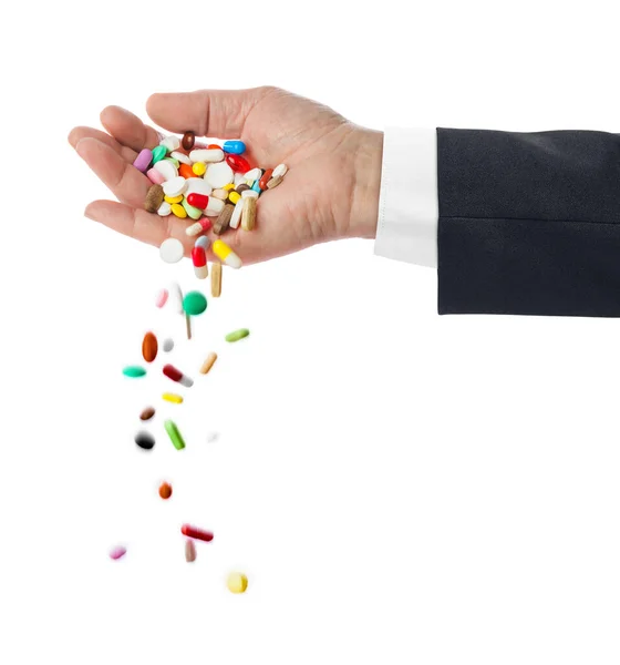 Hand and falling pills — Stock Photo, Image