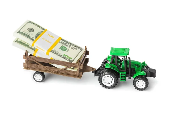 Speelgoed tractor met geld — Stockfoto