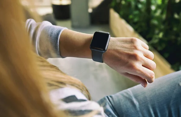Smart watch on female hand, close-up