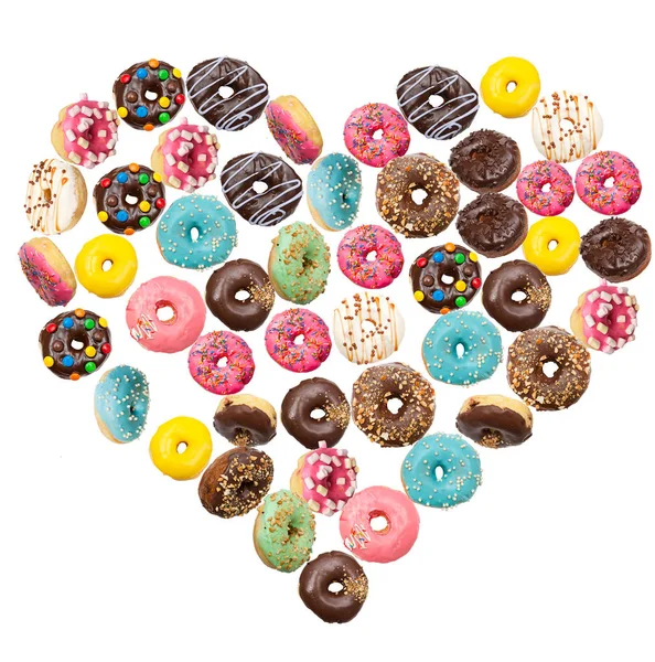 Много Вкусных Пончиков Летающих Воздухе Форме Сердца — стоковое фото