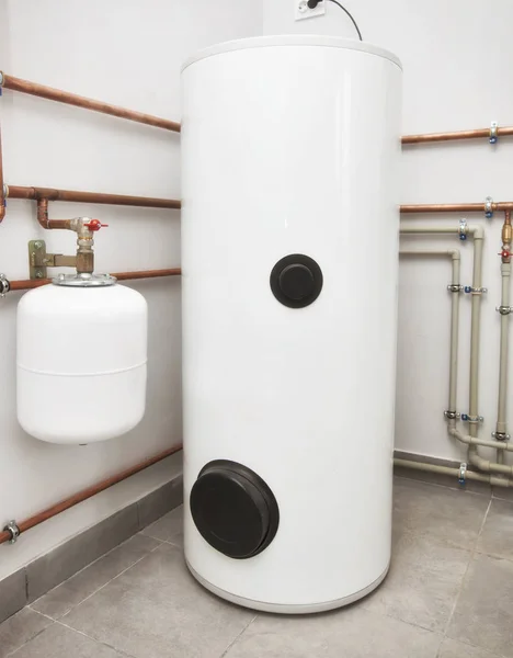 One modern white boiler in the boiler-room — Stock Image One Modern White Boiler Boiler Room Stock Photo