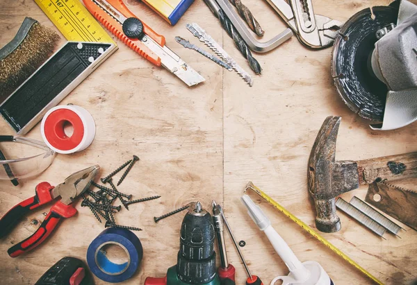 A lot of different tools on the wooden dirty table — Stock Photo, Image