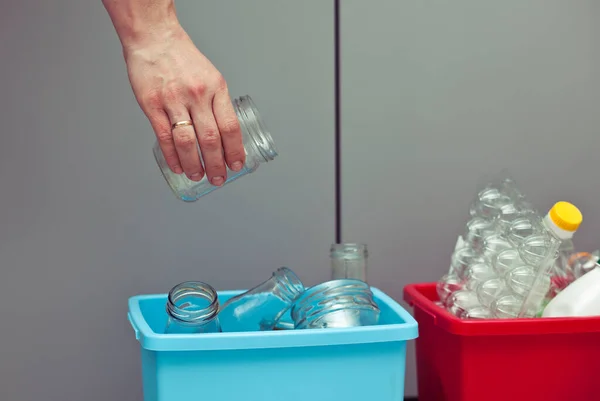 Woman Throws Glass Bottle One Four Container Sorting Garbage — Stock Photo, Image