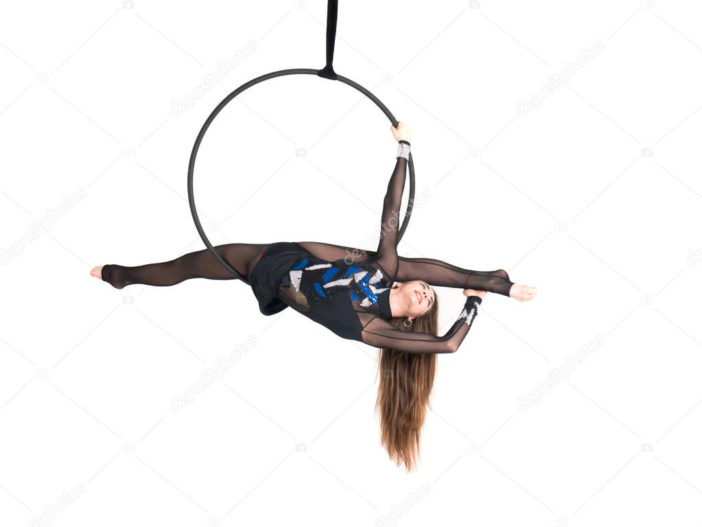 Young girl posing in an airy ring on a white background