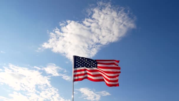 United States of America Flag. The red white and blue. U.S,A, Stars Stripes, flying with blue sky. — Stock Video