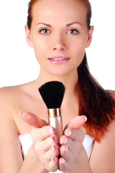 Beautiful young girl on spa procedures with tassel near face. — Stock Photo, Image