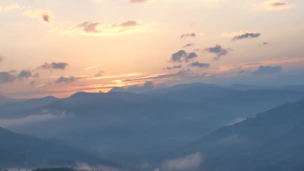 Brilliant summit dawn above flowing cloud waves, red sun disk time lapse — Stock Video