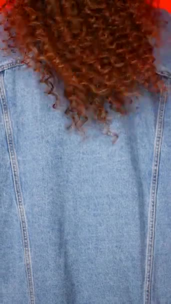 Beautiful young attractive woman with curly hair back , slow moving — Stock Video