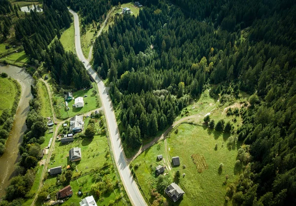 Aerial drone landscape photo of green forest trees growing on high rocky Carpathian mountains.Beautiful view of natural park in Southern Europe.Travel destination for active tourism and hiking