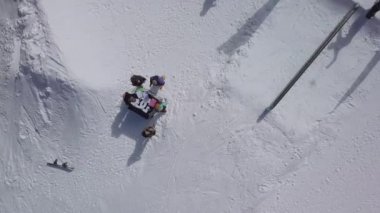YAREMCHE, UKRAINE - 24 MARCH, 2018: Snowboarders & free ski riders take part in jib contest.Athletes grind on rail in Bukovel Snow Park.Extreme winter sport competition for young and active sportsmen.