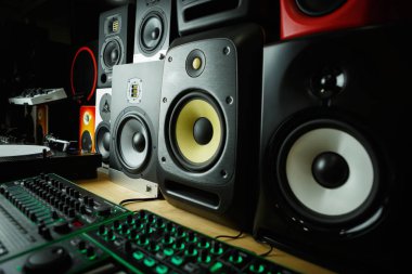 High quality loudspeakers in dj shop.Buy hifi sound system for sound recording studio.Professional hi-fi cabinet speaker box on sale.Audio equipment for audio record studios clipart