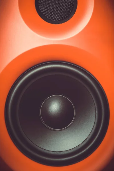 Hifi red loud speaker box in close up.Professional audio equipment for dj,musician.High quality sound recording studio equip.Focus on hi-fi diffusor speaker built in plastic cabinet box