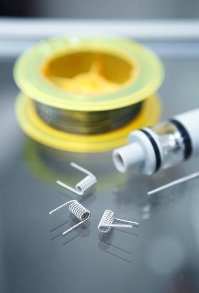 Vape shop.Modern vaping development service & upgrade parts in close up.Buy ualr ecig vaper device.Ic gadget for smoking ejuice.Box mod & wire
