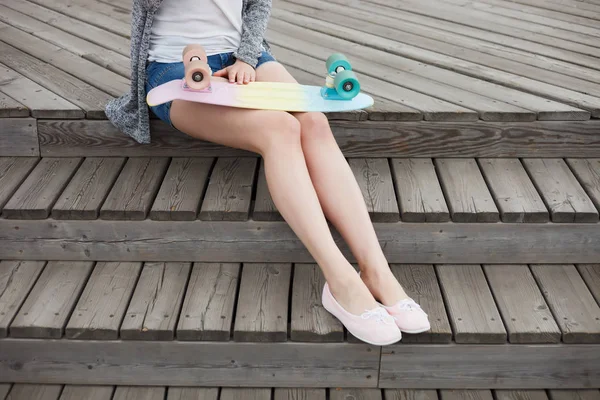 Young Woman Sitting Outdoors Holding Short Cruiser Skateboard Summer Day — Stock Photo, Image